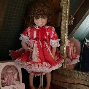 Red Frilly Doll with Curly Hair